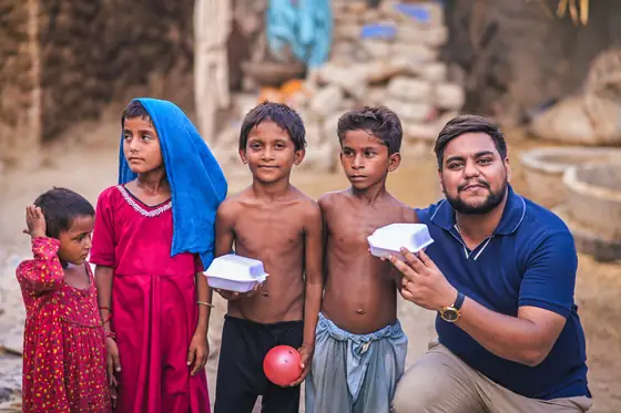 Children in Sindh receiving a hot meal