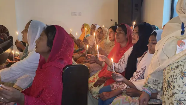 Women holding candles at the Easter vigil