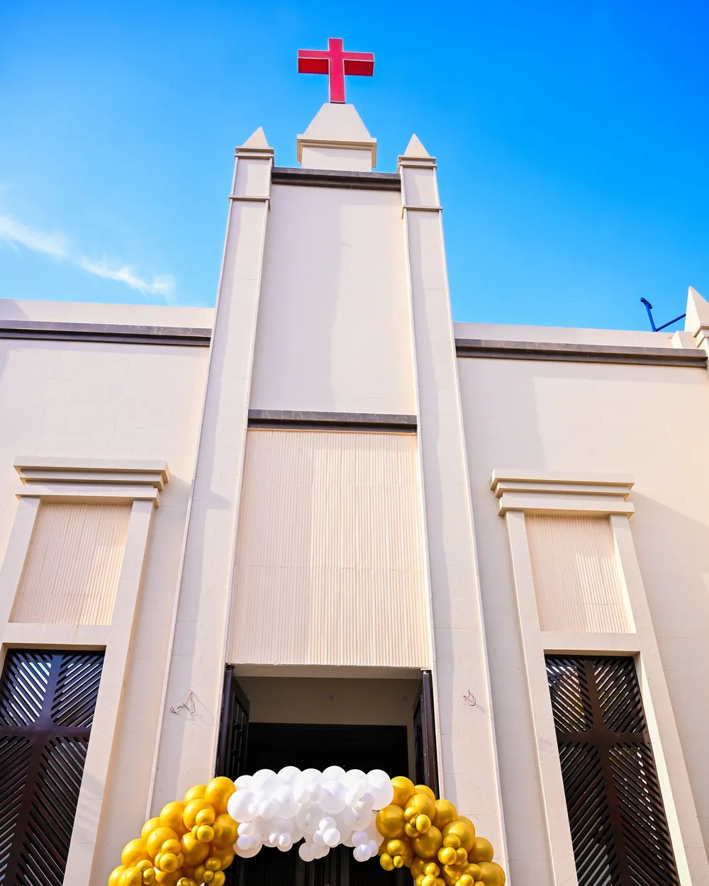Harvest Hands Church on the day it opened, its cross raised over Faisalabad