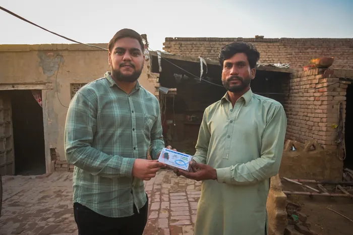 An audio Bible handed over at the door