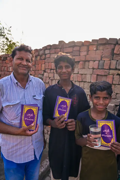 Two boys with their own copies of the Word