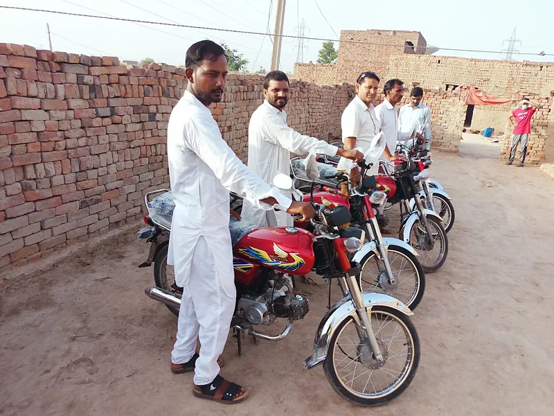 Motorbike distribution to Harvest Hands pastors
