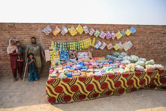The family beside their newly stocked shop